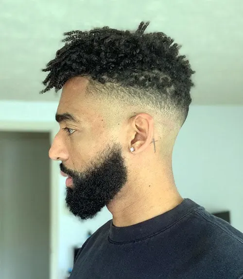 Mid Skin Fade with Kinky Curls and Thick Beard