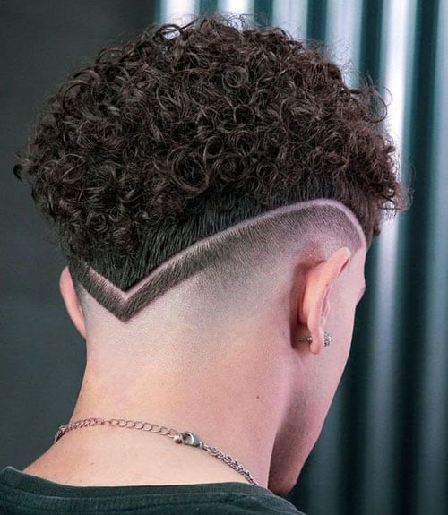 Tight Curls with V-Shaped Skin Fade