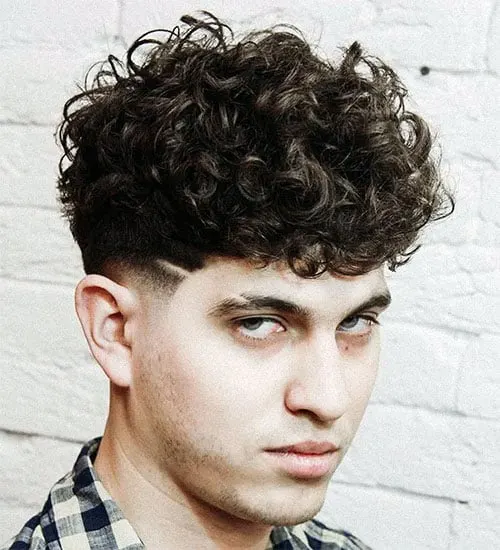 Medium-Length Tousled Curls with Low Skin Fade