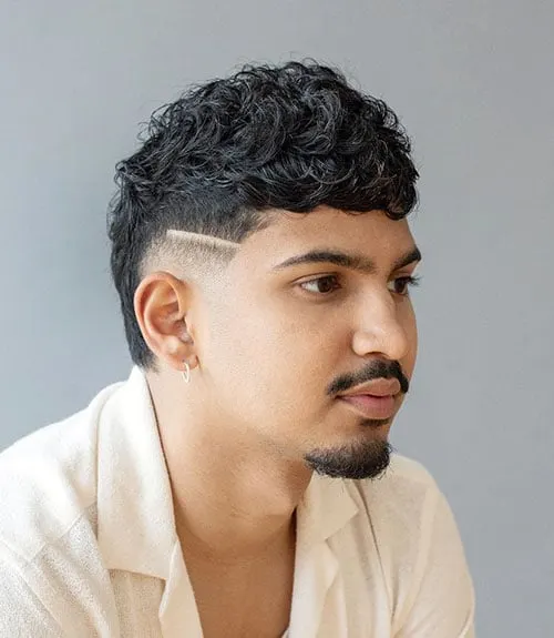Natural Curls with Mullet and Shaved Design