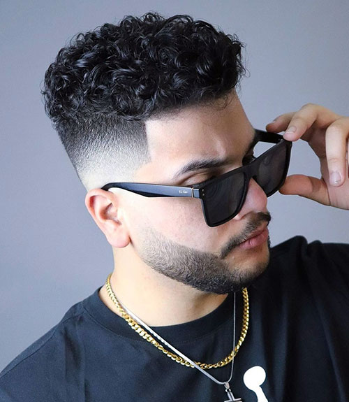Thick Curly Top with Undercut Fade